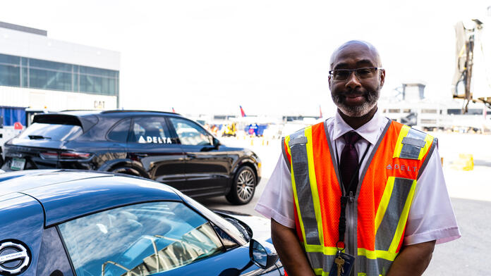 Delta Elite Services Agent Anthony Grant prepares to escort connecting customers at Hartsfield-Jackson Atlanta International Airport.