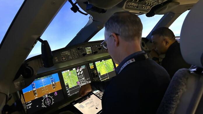 Capt. Marshall and Capt. Daniels concentrate on precision and timing ahead of the big day in the flight simulator on April 5.