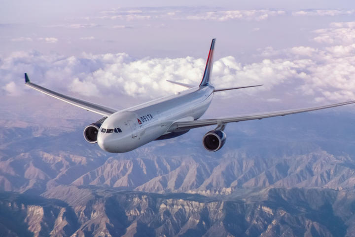A330-300 in flight over mountains