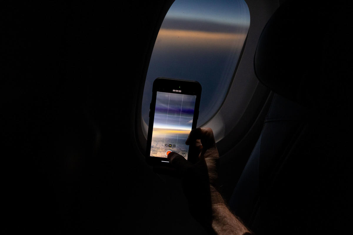 Customers on board DL 1010 from Dallas Fort Worth International Airport (DTW) to Detroit Wayne County Metropolitan Airport (DFW) view the solar eclipse.